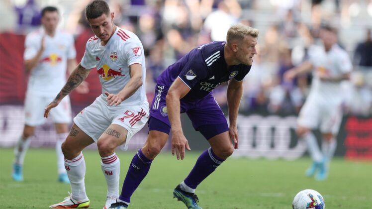 Apr 24, 2022; Orlando, Florida, USA; Orlando City defender Robin Jansson (6) looks to move the ball defended by New York Red Bulls forward Patryk Klimala (9) in the second half at Exploria Stadium. Mandatory Credit: Nathan Ray Seebeck-USA TODAY Sports