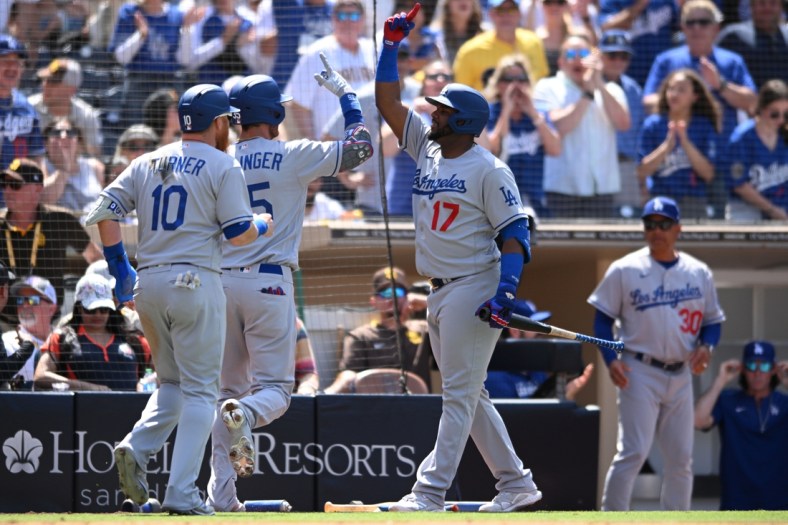 Apr 24, 2022; San Diego, California, USA; Los Angeles Dodgers center fielder Cody Bellinger (second from left) celebrates with second baseman Hanser Alberto (17) after hitting a three-run home run against the San Diego Padres during the fifth inning at Petco Park. Mandatory Credit: Orlando Ramirez-USA TODAY Sports