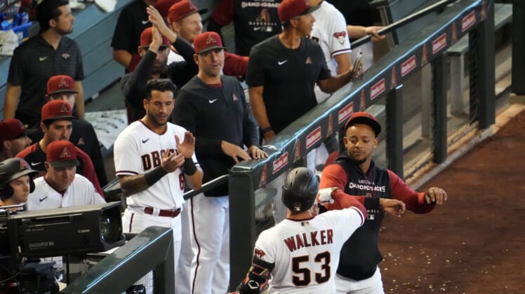 Apr 24, 2022; Phoenix, Arizona, USA; Arizona Diamondbacks first baseman Christian Walker (53) returns to the dugout after hitting a solo home run against the New York Mets during the fourth inning at Chase Field. Mandatory Credit: Joe Camporeale-USA TODAY Sports