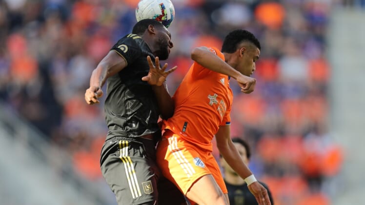 Apr 24, 2022; Cincinnati, Ohio, USA; Los Angeles FC defender Doneil Henry (44) heads the ball out of reach of FC Cincinnati forward Brenner (9) in the first half at TQL Stadium. Mandatory Credit: Katie Stratman-USA TODAY Sports