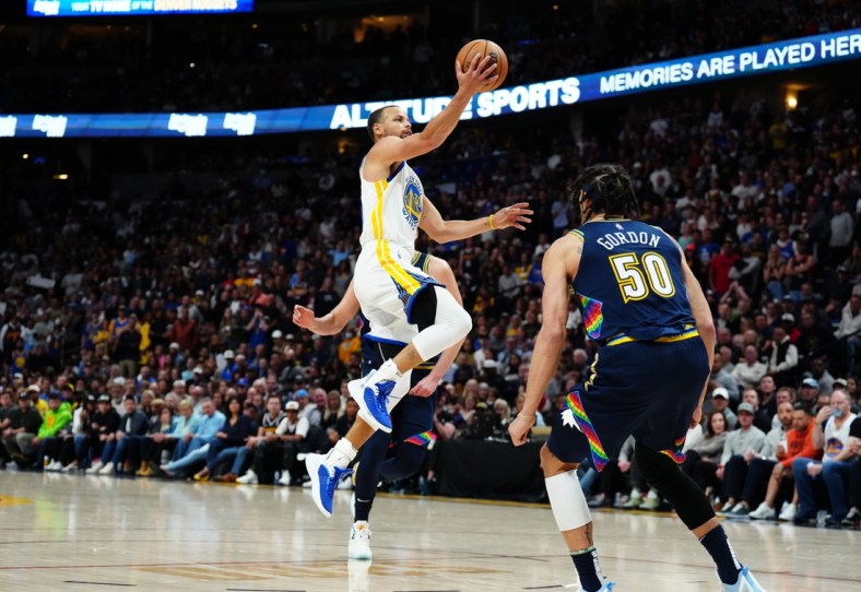 Apr 24, 2022; Denver, Colorado, USA; Golden State Warriors guard Stephen Curry (30) shoots the ball in the second half against the Denver Nuggets of the first round for the 2022 NBA playoffs at Ball Arena. Mandatory Credit: Ron Chenoy-USA TODAY Sports