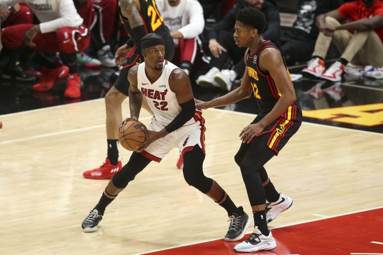 Apr 24, 2022; Atlanta, Georgia, USA; Miami Heat forward Jimmy Butler (22) is defended by Atlanta Hawks forward De'Andre Hunter (12) in the first quarter during game four of the first round for the 2022 NBA playoffs at State Farm Arena. Mandatory Credit: Brett Davis-USA TODAY Sports