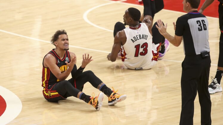 Apr 24, 2022; Atlanta, Georgia, USA; Atlanta Hawks guard Trae Young (11) reacts after being called for a foul by referee Brent Barnaky (36) against the Miami Heat in the first quarter during game four of the first round for the 2022 NBA playoffs at State Farm Arena. Mandatory Credit: Brett Davis-USA TODAY Sports