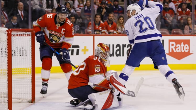 Apr 24, 2022; Sunrise, Florida, USA; Tampa Bay Lightning left wing Nicholas Paul (20) scores on Florida Panthers goaltender Spencer Knight (30) during the second period at FLA Live Arena. Mandatory Credit: Sam Navarro-USA TODAY Sports