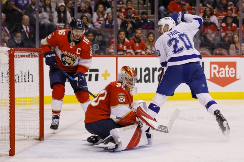 Apr 24, 2022; Sunrise, Florida, USA; Tampa Bay Lightning left wing Nicholas Paul (20) scores on Florida Panthers goaltender Spencer Knight (30) during the second period at FLA Live Arena. Mandatory Credit: Sam Navarro-USA TODAY Sports