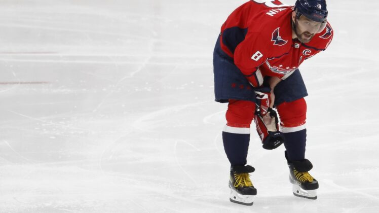 Apr 24, 2022; Washington, District of Columbia, USA; Washington Capitals left wing Alex Ovechkin (8) skates off the ice after being injured while crashing into the boards after being tripped on a breakaway attempt against the Toronto Maple Leafs in the third period at Capital One Arena. Mandatory Credit: Geoff Burke-USA TODAY Sports