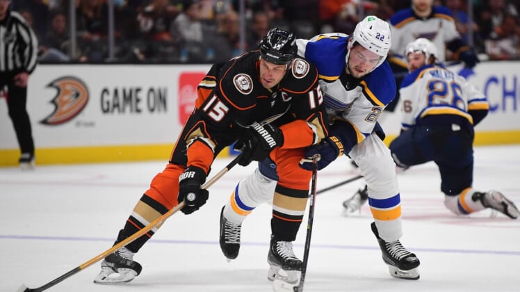 Apr 24, 2022; Anaheim, California, USA; Anaheim Ducks center Ryan Getzlaf (15) plays for the puck against St. Louis Blues center Logan Brown (22) during the second period at Honda Center. Mandatory Credit: Gary A. Vasquez-USA TODAY Sports