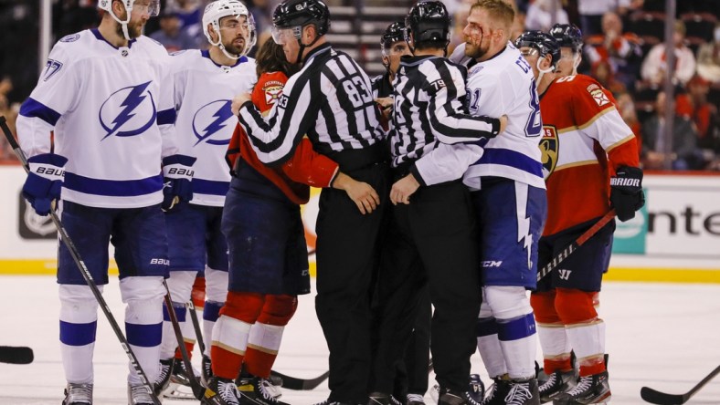 Apr 24, 2022; Sunrise, Florida, USA; Tampa Bay Lightning defenseman Erik Cernak (81) has blood coming down his eyebrow after fighting Florida Panthers left wing Ryan Lomberg (94) during the third period at FLA Live Arena. Mandatory Credit: Sam Navarro-USA TODAY Sports