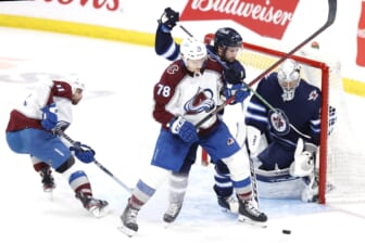 Apr 24, 2022; Winnipeg, Manitoba, CAN; Colorado Avalanche center Nico Sturm (78) is tangled up by Winnipeg Jets defenseman Josh Morrissey (44) in front of goaltender Connor Hellebuyck (37) in the third period at Canada Life Centre. Mandatory Credit: James Carey Lauder-USA TODAY Sports