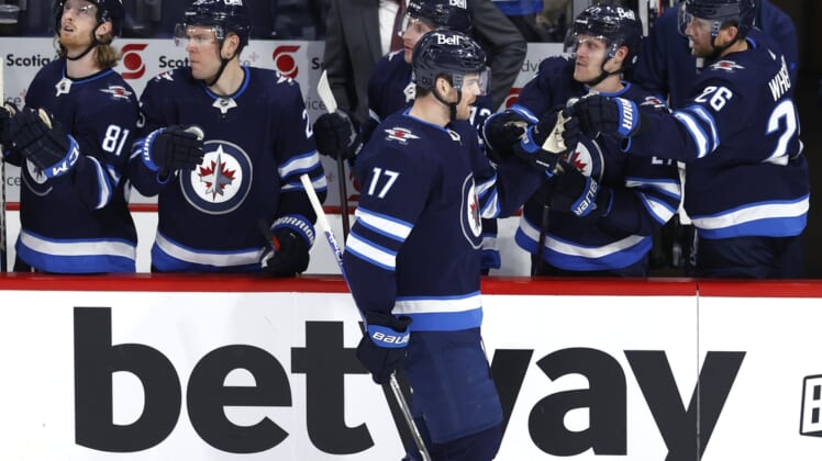 Apr 24, 2022; Winnipeg, Manitoba, CAN; Winnipeg Jets center Adam Lowry (17) celebrates his third period goal against the Colorado Avalanche at Canada Life Centre. Mandatory Credit: James Carey Lauder-USA TODAY Sports