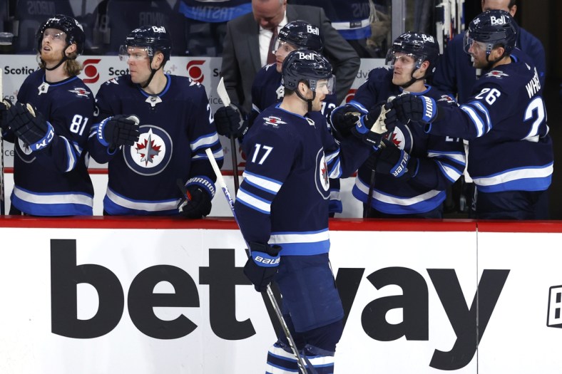 Apr 24, 2022; Winnipeg, Manitoba, CAN; Winnipeg Jets center Adam Lowry (17) celebrates his third period goal against the Colorado Avalanche at Canada Life Centre. Mandatory Credit: James Carey Lauder-USA TODAY Sports
