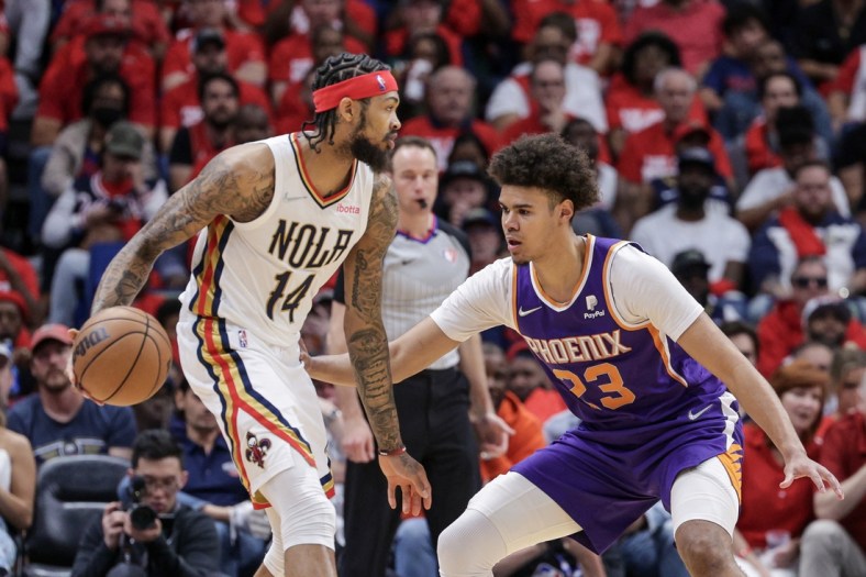 Apr 24, 2022; New Orleans, Louisiana, USA;  New Orleans Pelicans forward Brandon Ingram (14) dribbles against Phoenix Suns forward Cameron Johnson (23) during the first half of game four of the first round of the 2022 NBA playoffs at Smoothie King Center. Mandatory Credit: Stephen Lew-USA TODAY Sports