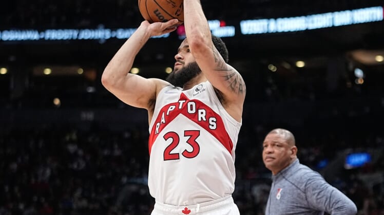 Apr 20, 2022; Toronto, Ontario, CAN; Toronto Raptors guard Fred VanVleet (23) tries to shoot for three points as Philadelphia 76ers head coach Doc Rivers looks on during game three of the first round for the 2022 NBA playoffs at Scotiabank Arena. Mandatory Credit: John E. Sokolowski-USA TODAY Sports