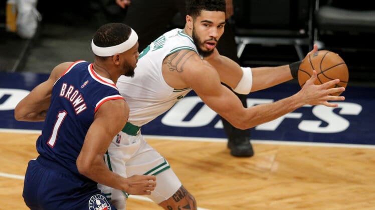 Apr 25, 2022; Brooklyn, New York, USA; Boston Celtics forward Jayson Tatum (0) controls the ball against Brooklyn Nets forward Bruce Brown (1) during the first quarter of game four of the first round of the 2022 NBA playoffs at Barclays Center. Mandatory Credit: Brad Penner-USA TODAY Sports