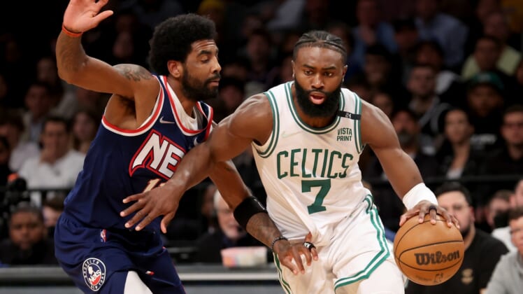 Apr 25, 2022; Brooklyn, New York, USA; Boston Celtics guard Jaylen Brown (7) controls the ball against Brooklyn Nets guard Kyrie Irving (11) during the fourth quarter of game four of the first round of the 2022 NBA playoffs at Barclays Center. The Celtics defeated the Nets 116-112 to win the best of seven series 4-0. Mandatory Credit: Brad Penner-USA TODAY Sports