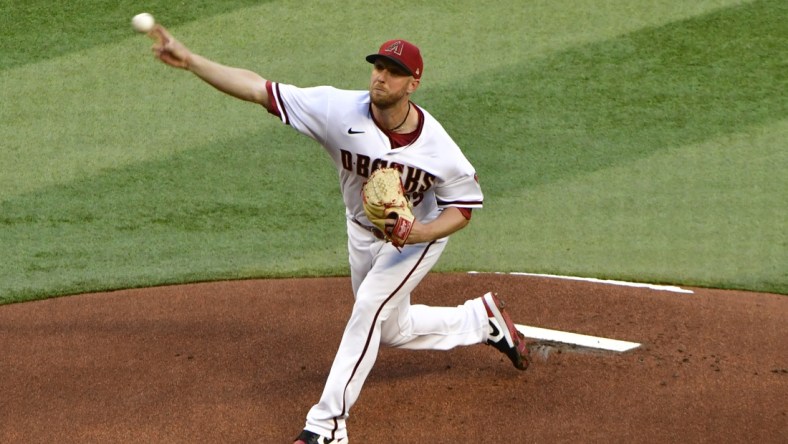 Apr 25, 2022; Phoenix, Arizona, USA; Arizona Diamondbacks starting pitcher Merrill Kelly (29) throws in the first inning against the Los Angeles Dodgers at Chase Field. Mandatory Credit: Matt Kartozian-USA TODAY Sports