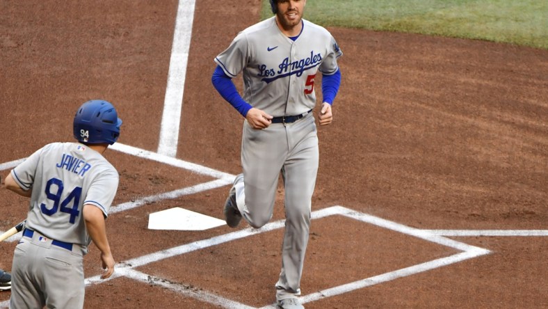 Apr 25, 2022; Phoenix, Arizona, USA; Los Angeles Dodgers first baseman Freddie Freeman (5) scores in the first inning against the Arizona Diamondbacks at Chase Field. Mandatory Credit: Matt Kartozian-USA TODAY Sports