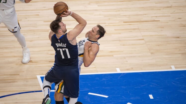 Apr 25, 2022; Dallas, Texas, USA; Dallas Mavericks guard Luka Doncic (77) is fouled by Utah Jazz forward Bojan Bogdanovic (44) during the second quarter in game five of the first round for the 2022 NBA playoffs at American Airlines Center. Mandatory Credit: Jerome Miron-USA TODAY Sports