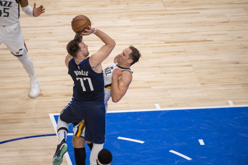 Apr 25, 2022; Dallas, Texas, USA; Dallas Mavericks guard Luka Doncic (77) is fouled by Utah Jazz forward Bojan Bogdanovic (44) during the second quarter in game five of the first round for the 2022 NBA playoffs at American Airlines Center. Mandatory Credit: Jerome Miron-USA TODAY Sports