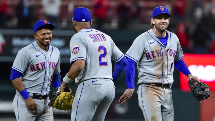 Apr 25, 2022; St. Louis, Missouri, USA;  New York Mets second baseman Jeff McNeil (1) and third baseman Eduardo Escobar (10) celebrate with first baseman Dominic Smith (2) after the Mets defeated the St. Louis Cardinals at Busch Stadium. Mandatory Credit: Jeff Curry-USA TODAY Sports