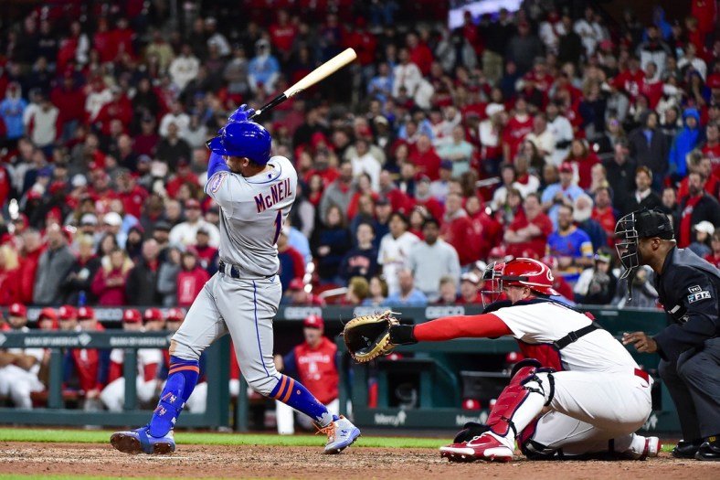Apr 25, 2022; St. Louis, Missouri, USA;  New York Mets second baseman Jeff McNeil (1) hits a single against the St. Louis Cardinals during the ninth inning at Busch Stadium. Mandatory Credit: Jeff Curry-USA TODAY Sports