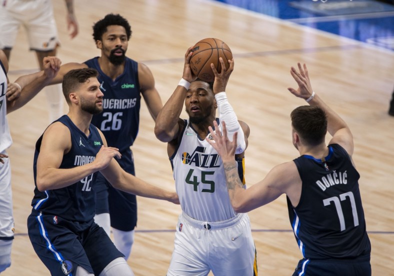 Apr 25, 2022; Dallas, Texas, USA; Dallas Mavericks forward Maxi Kleber (42) and guard Luka Doncic (77) defend against Utah Jazz guard Donovan Mitchell (45) during the fourth quarter in game five of the first round for the 2022 NBA playoffs at American Airlines Center. Mandatory Credit: Jerome Miron-USA TODAY Sports