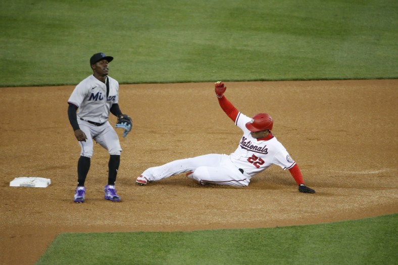 Apr 26, 2022; Washington, District of Columbia, USA; Washington Nationals right fielder Juan Soto (22) steals second base in front of Miami Marlins second baseman Jazz Chisholm Jr. (2) during the first inning against at Nationals Park. Mandatory Credit: Amber Searls-USA TODAY Sports