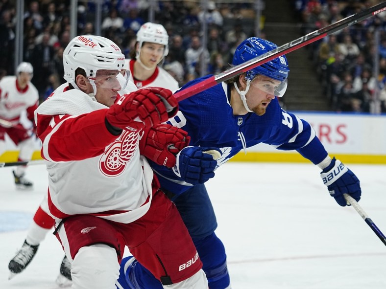Apr 26, 2022; Toronto, Ontario, CAN; Toronto Maple Leafs forward William Nylander (88) and Detroit Red Wings forward Jakub Vrana (15) battle for position during the first period at Scotiabank Arena. Mandatory Credit: John E. Sokolowski-USA TODAY Sports