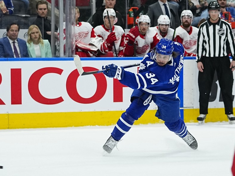Apr 26, 2022; Toronto, Ontario, CAN; Toronto Maple Leafs forward Auston Matthews (34) shoots the puck against the Detroit Red Wings during the first period at Scotiabank Arena. Mandatory Credit: John E. Sokolowski-USA TODAY Sports