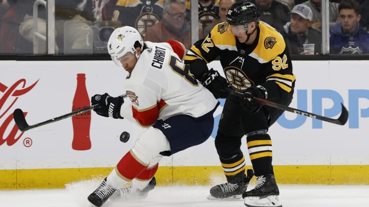 Apr 26, 2022; Boston, Massachusetts, USA; Florida Panthers defenseman Ben Chiarot (8) and Boston Bruins left wing Tomas Nosek (92) battle for the puck during the first period at TD Garden. Mandatory Credit: Winslow Townson-USA TODAY Sports