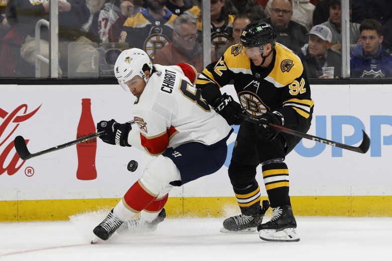 Apr 26, 2022; Boston, Massachusetts, USA; Florida Panthers defenseman Ben Chiarot (8) and Boston Bruins left wing Tomas Nosek (92) battle for the puck during the first period at TD Garden. Mandatory Credit: Winslow Townson-USA TODAY Sports