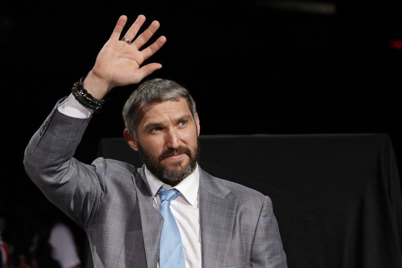 Apr 26, 2022; Washington, District of Columbia, USA; Injured Washington Capitals left wing Alex Ovechkin waves to fans during a ceremony honoring his becoming 3rd highest goal scorer in NHL history prior to the Capitals game against the New York Islanders at Capital One Arena. Mandatory Credit: Geoff Burke-USA TODAY Sports