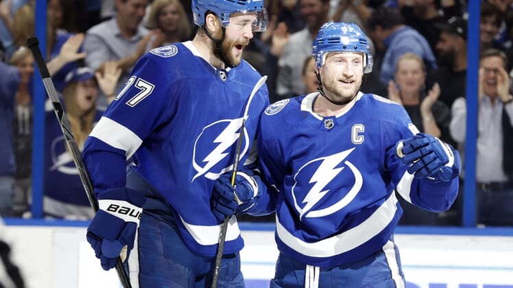 Apr 26, 2022; Tampa, Florida, USA; Tampa Bay Lightning center Steven Stamkos (91) is congratulated by defenseman Victor Hedman (77) after scoring a goal against the Columbus Blue Jackets during the first period at Amalie Arena. Mandatory Credit: Kim Klement-USA TODAY Sports
