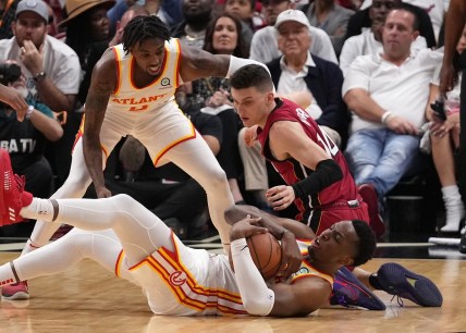 Apr 26, 2022; Miami, Florida, USA; Atlanta Hawks forward Onyeka Okongwu (17) battles Miami Heat guard Tyler Herro (14) for control of a loose ball during the first half in game five of the first round for the 2022 NBA playoffs at FTX Arena. Mandatory Credit: Jasen Vinlove-USA TODAY Sports