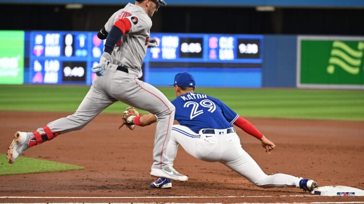 Apr 26, 2022; Toronto, Ontario, CAN; Boston Red Sox second baseman Trevor Story (10) is forced out at first base by Toronto Blue Jays first Gosuke Katoh (29) in the third inning at Rogers Centre. Mandatory Credit: Dan Hamilton-USA TODAY Sports