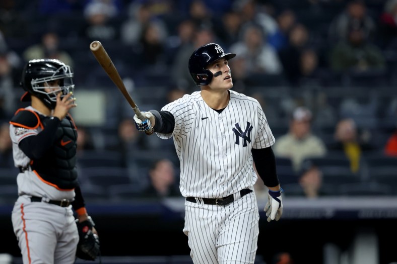 Apr 26, 2022; Bronx, New York, USA; New York Yankees first baseman Anthony Rizzo (48) follows through on a two run home run against the Baltimore Orioles during the fifth inning at Yankee Stadium. Mandatory Credit: Brad Penner-USA TODAY Sports