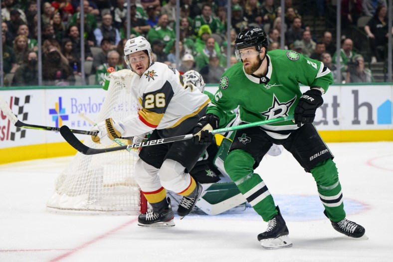 Apr 26, 2022; Dallas, Texas, USA; Dallas Stars defenseman Jani Hakanpaa (2) defends against Vegas Golden Knights center Mattias Janmark (26) during the first period at the American Airlines Center. Mandatory Credit: Jerome Miron-USA TODAY Sports