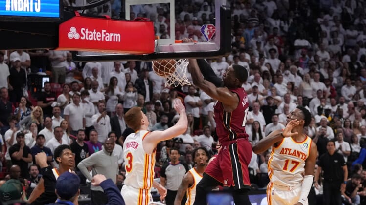 Apr 26, 2022; Miami, Florida, USA; Miami Heat center Bam Adebayo (13) dunks the ball over Atlanta Hawks guard Kevin Huerter (3) during the second half in game five of the first round for the 2022 NBA playoffs at FTX Arena. Mandatory Credit: Jasen Vinlove-USA TODAY Sports