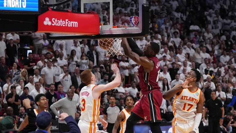 Apr 26, 2022; Miami, Florida, USA; Miami Heat center Bam Adebayo (13) dunks the ball over Atlanta Hawks guard Kevin Huerter (3) during the second half in game five of the first round for the 2022 NBA playoffs at FTX Arena. Mandatory Credit: Jasen Vinlove-USA TODAY Sports