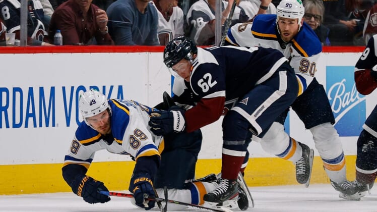Apr 26, 2022; Denver, Colorado, USA; St. Louis Blues left wing Pavel Buchnevich (89) is pulled down by Colorado Avalanche left wing Artturi Lehkonen (62) as center Ryan O'Reilly (90) defends in the first period at Ball Arena. Mandatory Credit: Isaiah J. Downing-USA TODAY Sports