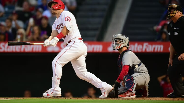 Apr 26, 2022; Anaheim, California, USA; Los Angeles Angels center fielder Mike Trout (27) hits a two run home run against the Cleveland Guardians during the third inning at Angel Stadium. Mandatory Credit: Gary A. Vasquez-USA TODAY Sports