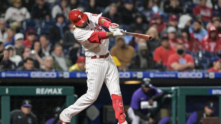 Apr 26, 2022; Philadelphia, Pennsylvania, USA;  Philadelphia Phillies right fielder Nick Castellanos (8) hits an RBI single during the sixth inning of the game against the Colorado Rockies at Citizens Bank Park. The Phillies won 10-3. Mandatory Credit: John Geliebter-USA TODAY Sports