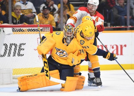 Apr 26, 2022; Nashville, Tennessee, USA; Nashville Predators goaltender Juuse Saros (74) makes a save during the third period against the Calgary Flames at Bridgestone Arena. Mandatory Credit: Christopher Hanewinckel-USA TODAY Sports