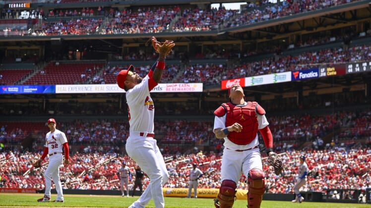 Apr 27, 2022; St. Louis, Missouri, USA;  St. Louis Cardinals third baseman Edmundo Sosa (63) calls off catcher Yadier Molina (4) and catches a foul ball against the New York Mets during the second inning at Busch Stadium. Mandatory Credit: Jeff Curry-USA TODAY Sports