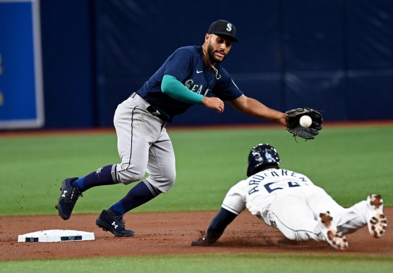 Apr 27, 2022; St. Petersburg, Florida, USA; Seattle Mariners second baseman Abraham Toro (13) waits for the ball as Tampa Bay Rays left fielder Randy Arozarena (56) slides into second base in the first inning at Tropicana Field. Mandatory Credit: Jonathan Dyer-USA TODAY Sports