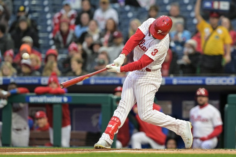 Apr 27, 2022; Philadelphia, Pennsylvania, USA; Philadelphia Phillies designated hitter Bryce Harper (3) hits a single during the first inning against the Colorado Rockies at Citizens Bank Park. Mandatory Credit: John Geliebter-USA TODAY Sports