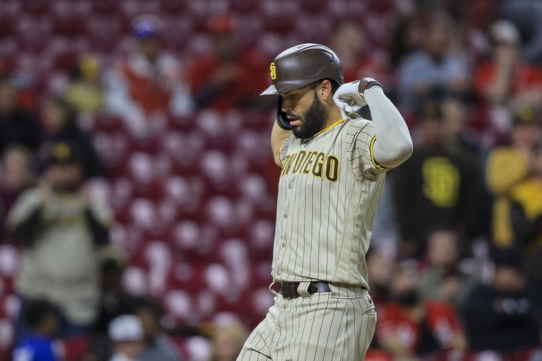 Apr 27, 2022; Cincinnati, Ohio, USA; San Diego Padres first baseman Eric Hosmer (30) reacts after hitting a home run against the Cincinnati Reds in the eighth inning at Great American Ball Park. Mandatory Credit: Katie Stratman-USA TODAY Sports