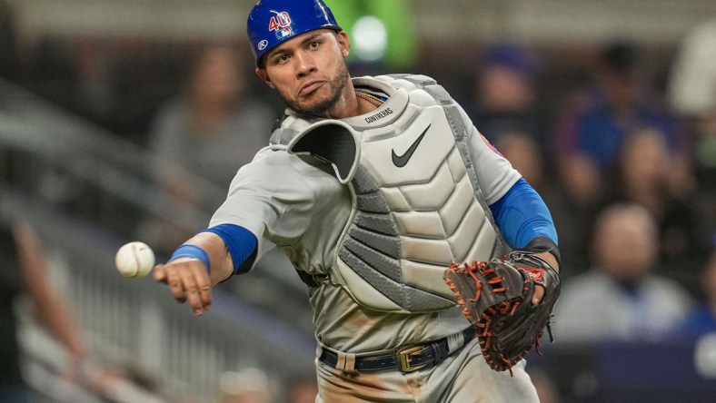 Apr 27, 2022; Cumberland, Georgia, USA; Chicago Cubs catcher Willson Contreras (40) throws out Atlanta Braves first baseman Matt Olson (28) (not shown) after a dropped third strike during the ninth inning at Truist Park. Mandatory Credit: Dale Zanine-USA TODAY Sports