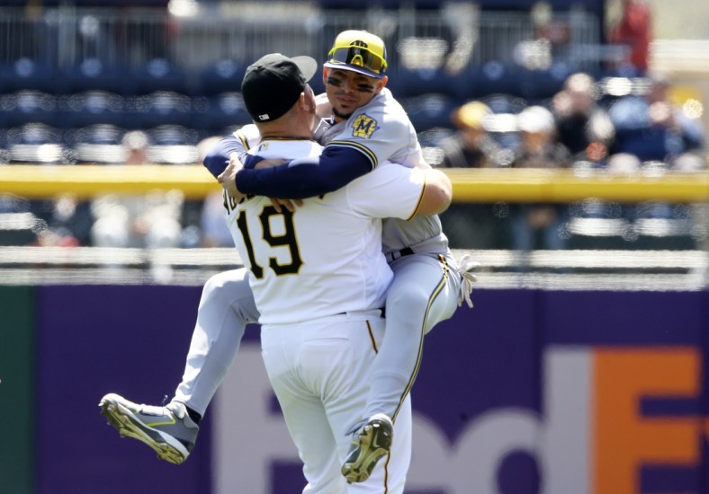 Apr 28, 2022; Pittsburgh, Pennsylvania, USA;  Pittsburgh Pirates designated hitter Daniel Vogelbach (19) and Milwaukee Brewers shortstop Willy Adames (right) greet each other in the outfield before playing at PNC Park. Mandatory Credit: Charles LeClaire-USA TODAY Sports