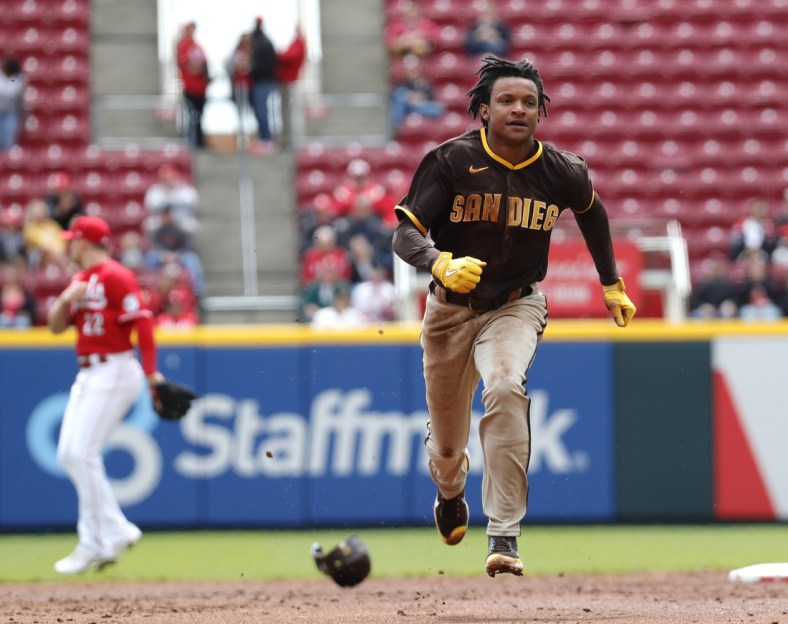 Apr 28, 2022; Cincinnati, Ohio, USA; San Diego Padres shortstop C.J. Abrams (77) runs to third base after a pickoff error against the Cincinnati Reds during the second inning at Great American Ball Park. Mandatory Credit: David Kohl-USA TODAY Sports